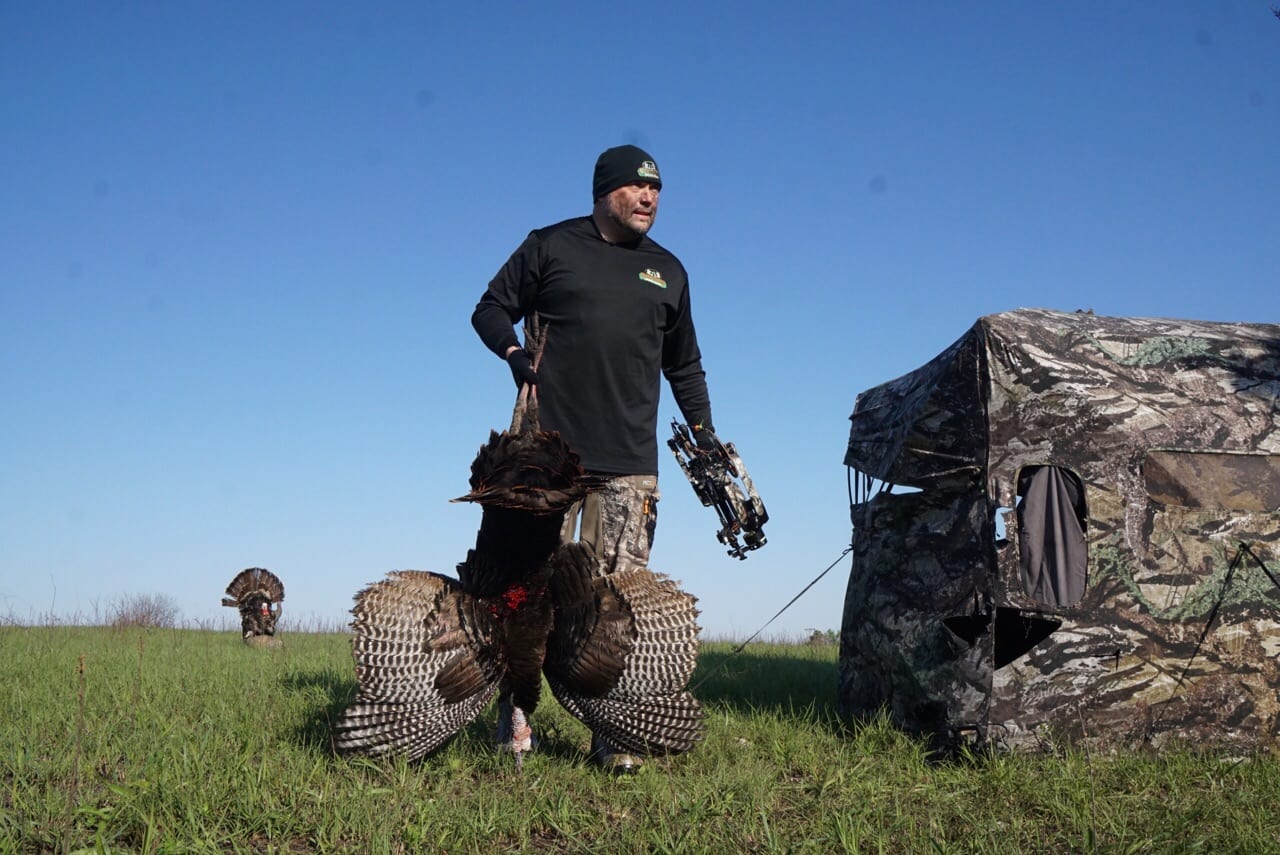 hunter walking with turkey