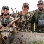 Bowhunter Chris Bee and friends with a big mule deer.