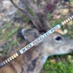 Easton X10 Pro arrow shaft in front of a dead blacktail buck