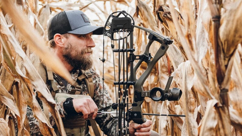 hunter in the field with hoyt rx-9 compound bow