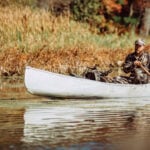 hunter in kayak