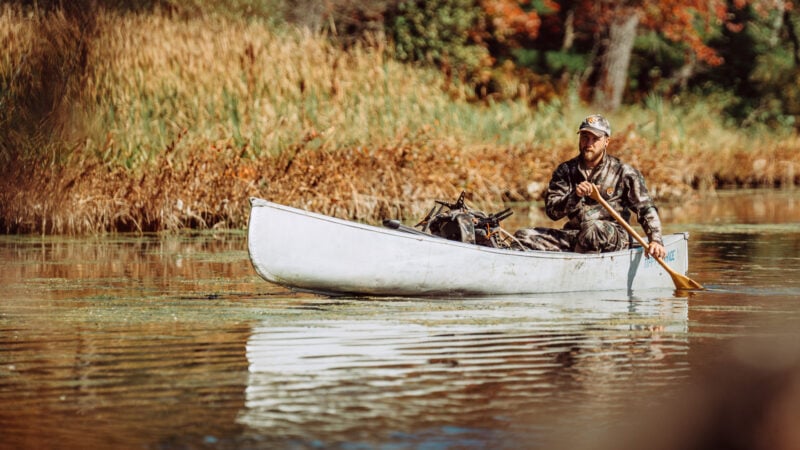 hunter in kayak